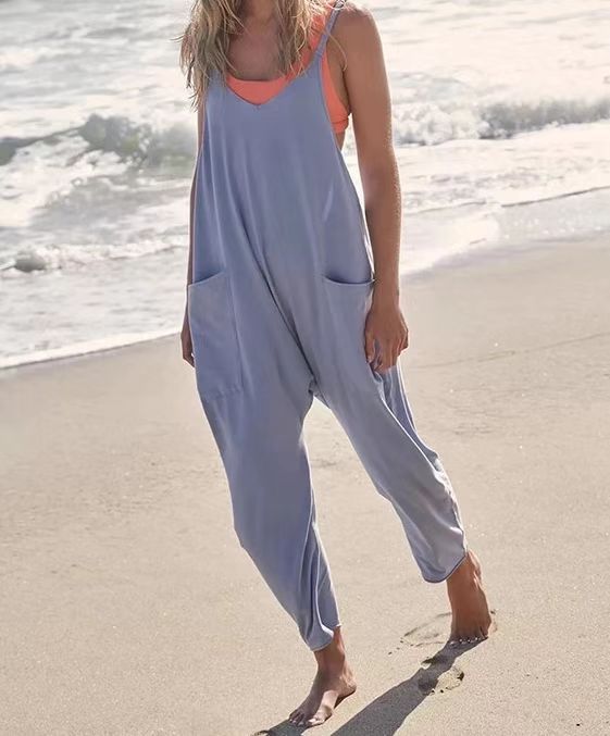 Breezy Chic Sleeveless Jumpsuit: Spaghetti Strap Romper with Pockets